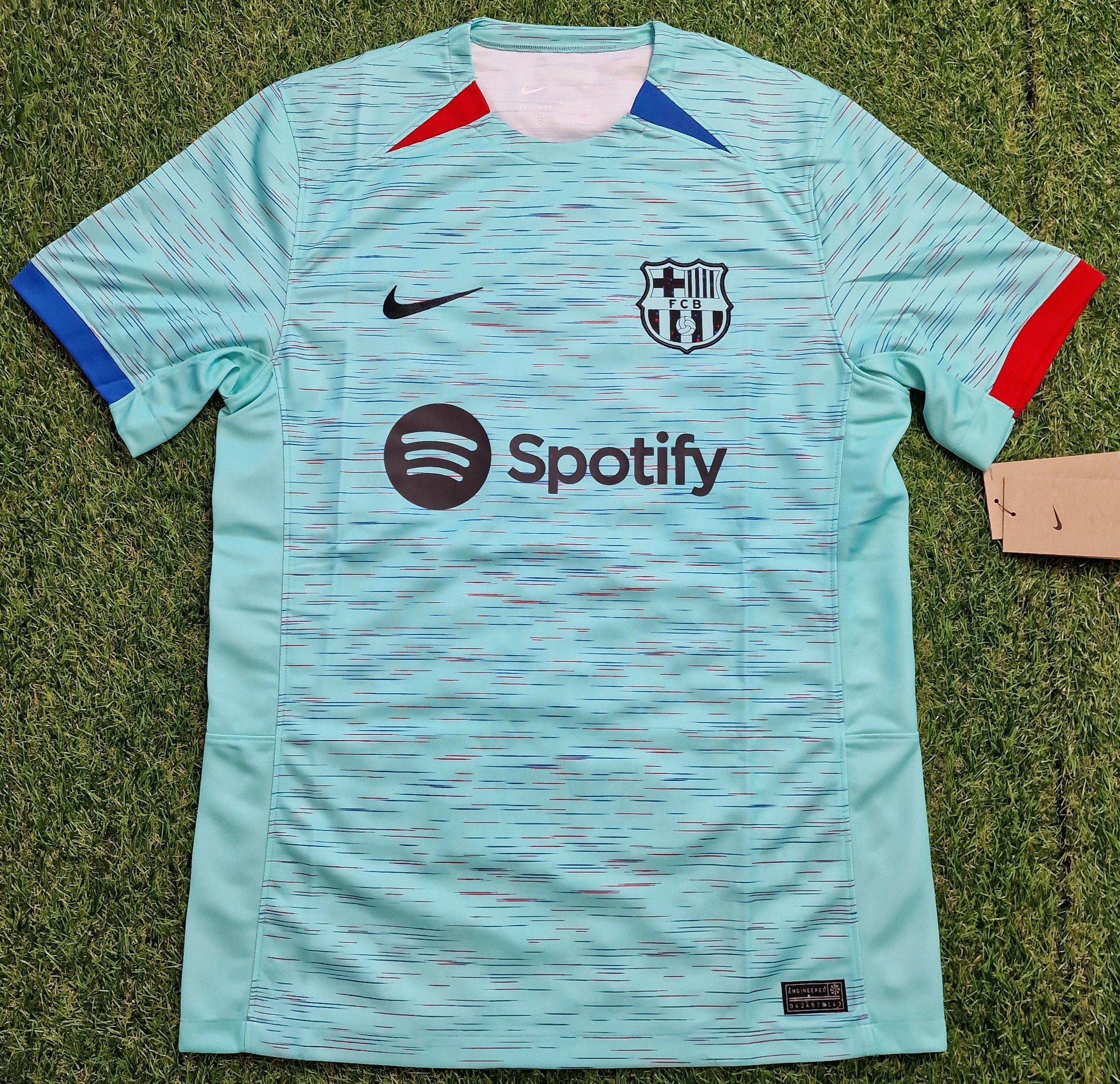 Aqua F.C. Barcelona Nike Third Shirt 23/24, made from 100% recycled polyester with a new pattern designed for sustainability, featuring iconic club crest and sponsor logos.