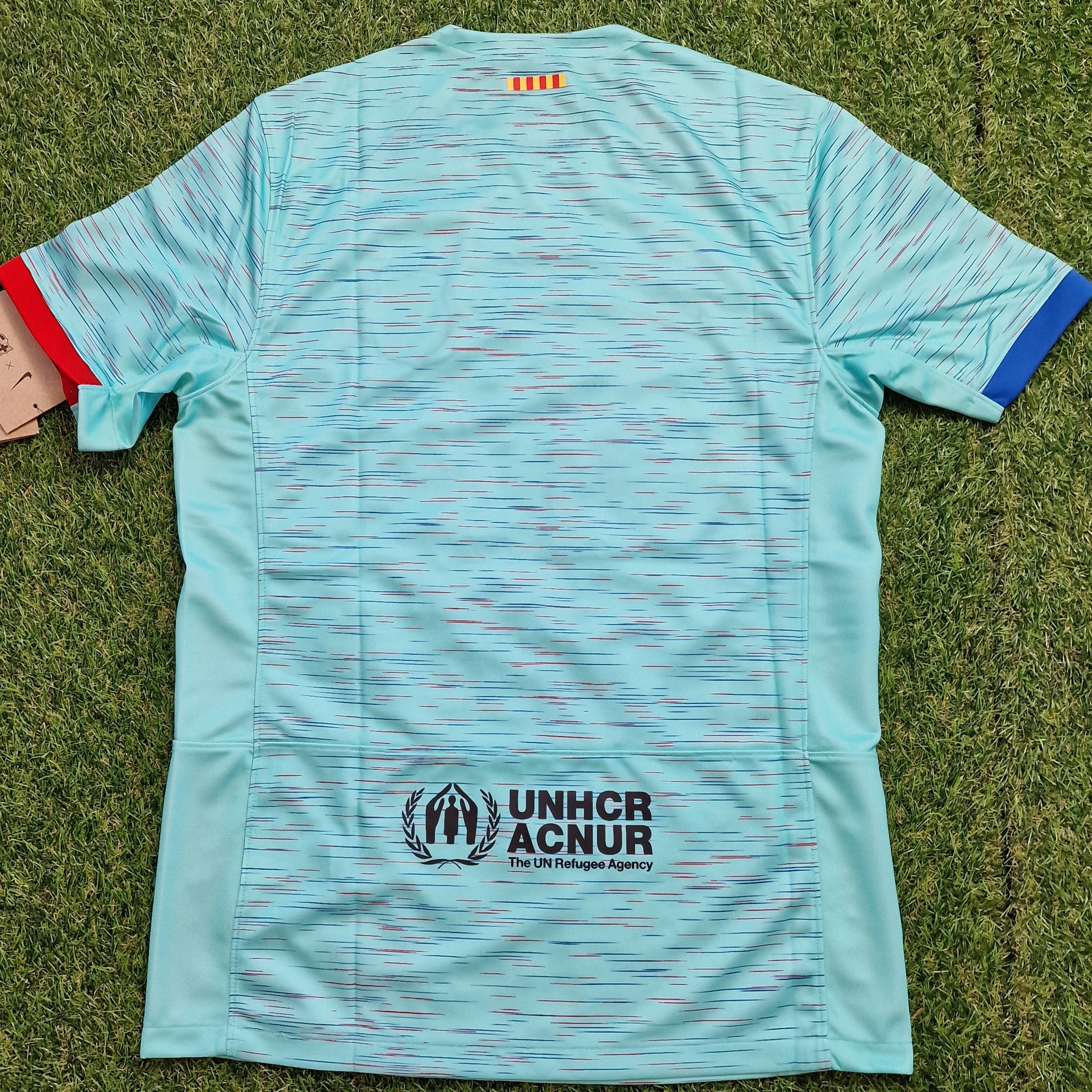 Aqua Barcelona Nike Third Shirt 23/24, crafted from sustainable 100% recycled polyester with a unique pattern aimed at reducing material waste, showcasing the iconic club crest and sponsor logos.